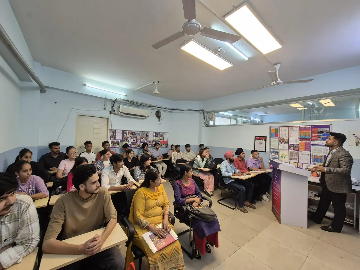 A full IELTS BAND7 classroom in Dehradun with a trainer teaching at the front